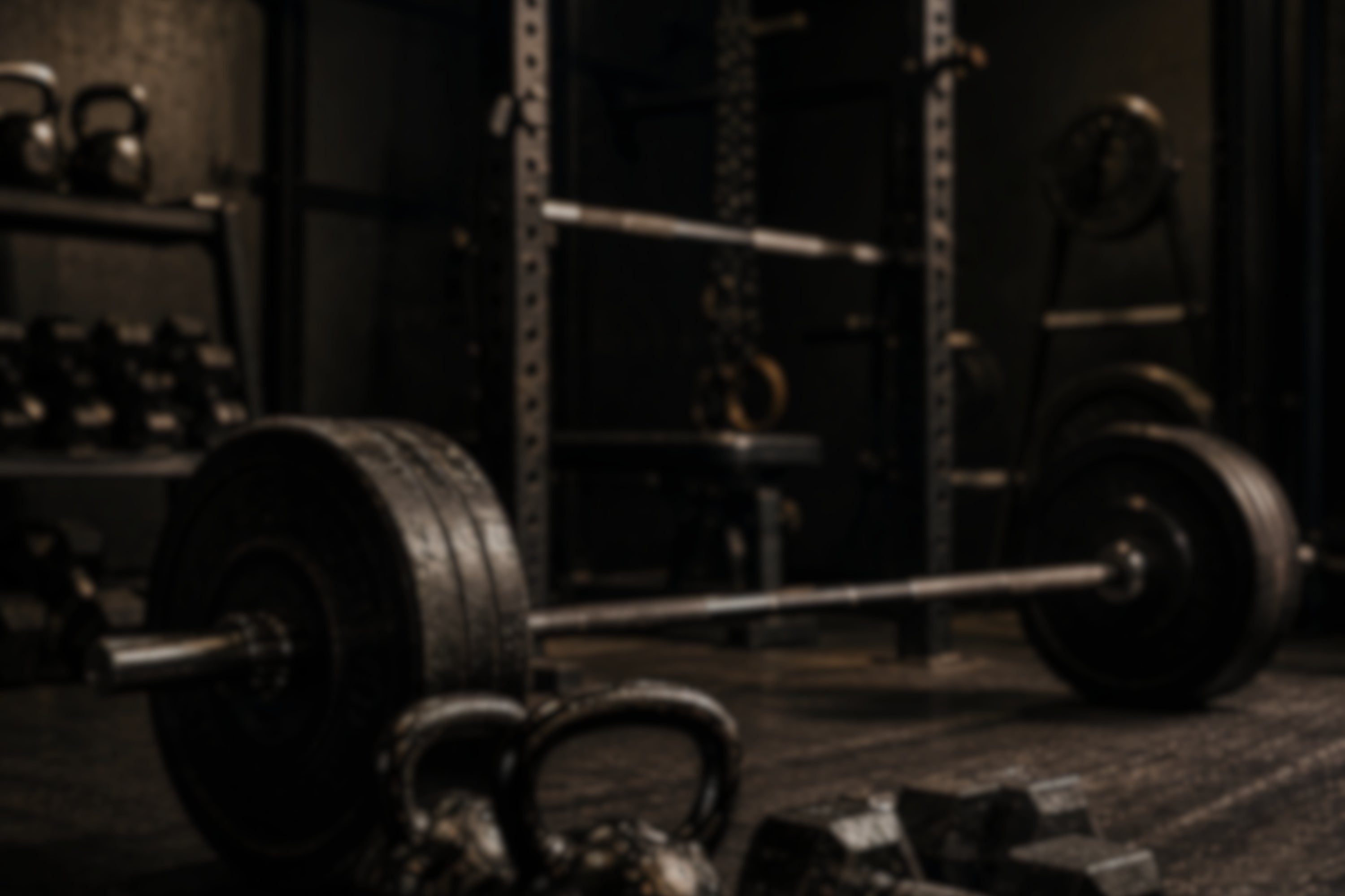 Barbell with weights in a gym setting